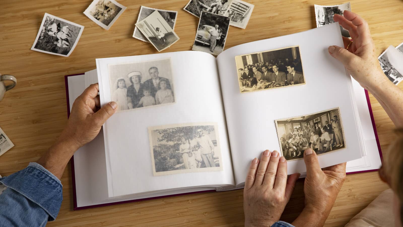Family looking through a photo album together, keeping memories instead of every object