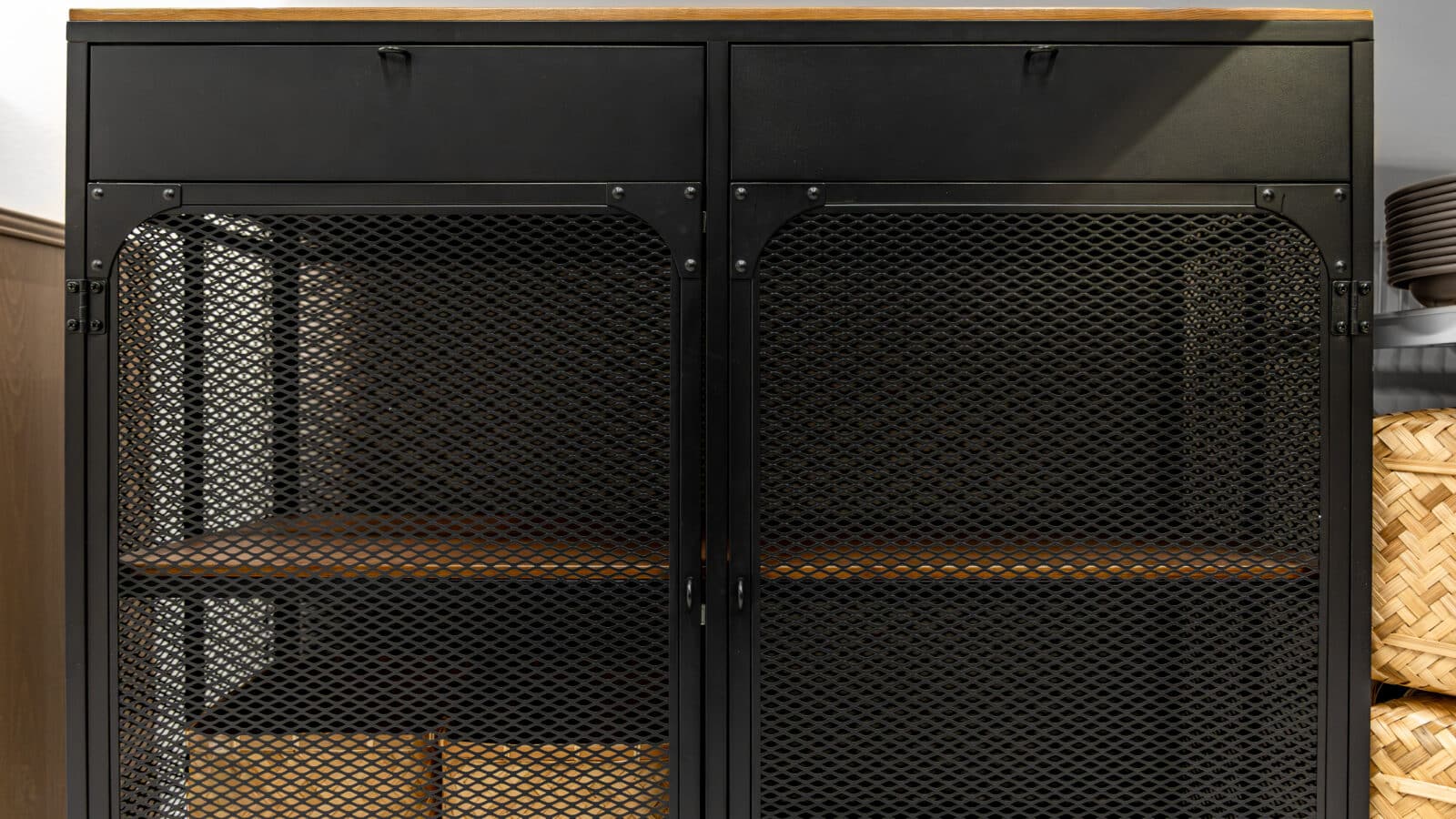 Overhead ceiling storage rack with mesh bins in a garage