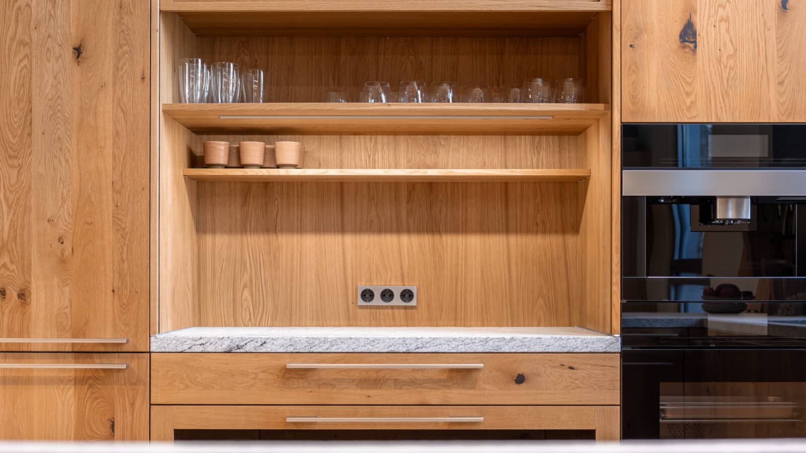 Minimalist kitchen with wooden cabinets and open shelving