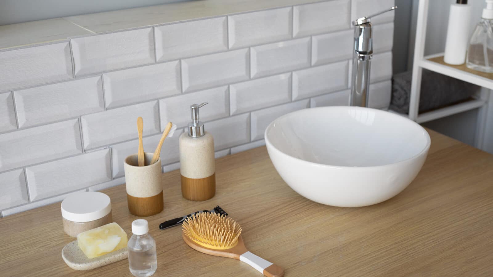Bathroom sink counter with toiletries staged in a tray, seen from above